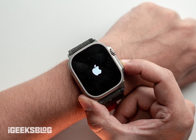 Pressing the Side button to restart an Apple Watch